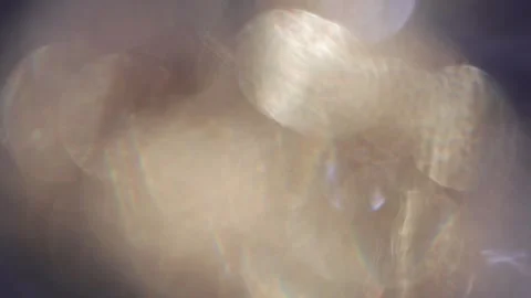 Large, bright, full-frame bokeh of sparkling gold and blue Video stock 318774670