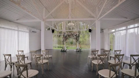 A large bright hall with a festive arch at the end of the hall Stock Footage 247570601