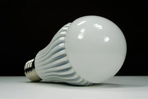 Large bright LED bulb with E27 fitting on white background for product catalo Stock Photos