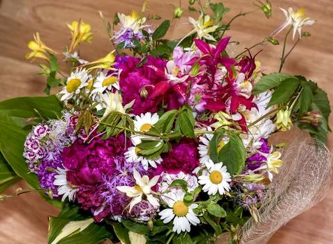 Large bright multi-colored bouquet of wildflowers with peonies and aquilegia Stock Photos