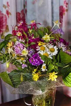 Large bright multi-colored bouquet of wildflowers with peonies and aquilegia Stock Photos