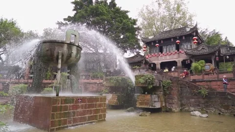 Large Bronze Ding Cauldron Fountain in Ancient Plaza at Huanglongxi Ancient Town Stock Footage 339213651