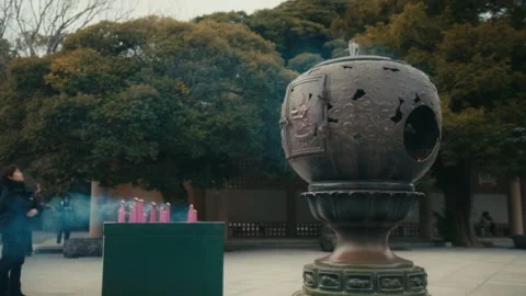 Large Bronze Incense Burner with Candles at Kotoku-in Temple, Kamakura Stock Footage 345376488