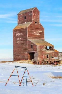 A large brown grain elevator in winter Stock Photos