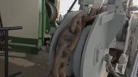 Large brown rusty anchor chain moves downwards closeup Stock Footage 113454723