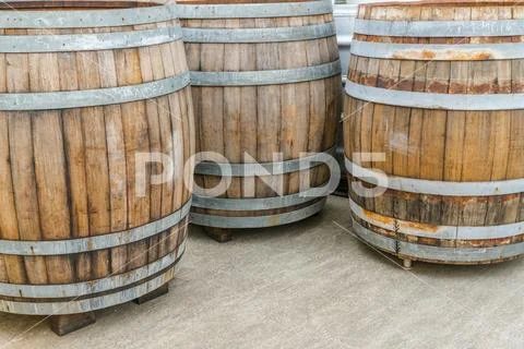 Large brown wooden barrels or wine vats Stock Photos
