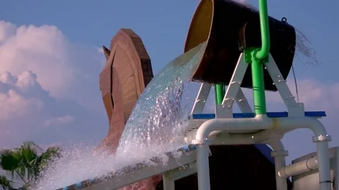 Large bucket with water splashes in the park Stock Footage 161781593