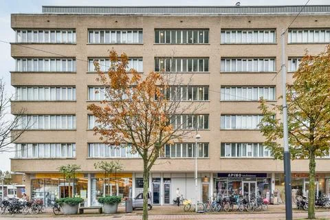 A large building with bikes parked outside of it Stock Photos