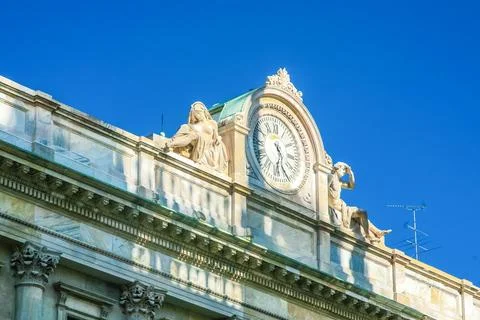 A large building with a clock on the front in Milano city Italy Foto stock