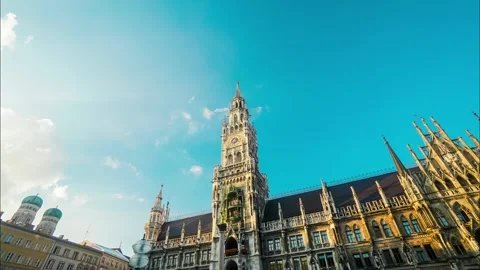 A large building with a clock tower and a blue sky in the background Stock Footage 313603305