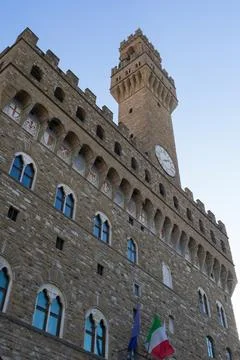A large building with a clock tower on top of it Stock Photos