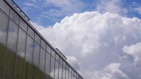 A large building with a cloudy sky in the background Stock Footage 297775028