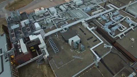 Large building with complex network of aeration system viewed by drone - 24fps Stock Footage 104071697