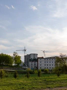 A large building with a crane in the background 스톡 사진