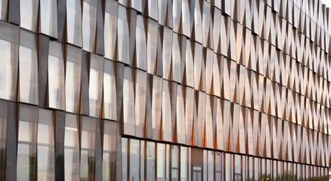 A large building that features a substantial number of windows on its facade Stock-Fotos