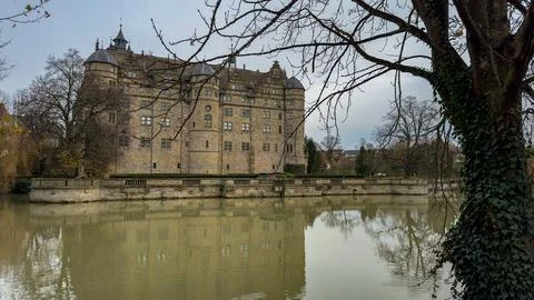 A large building with a large tree in front of it Stock Photos