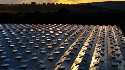 A large building with many windows and a sunset in the background Stock Footage 297844529