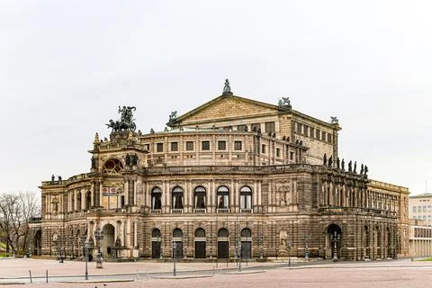 A large building Semper Opera Dresden in Germany with a lot of statues on it Stock Photos