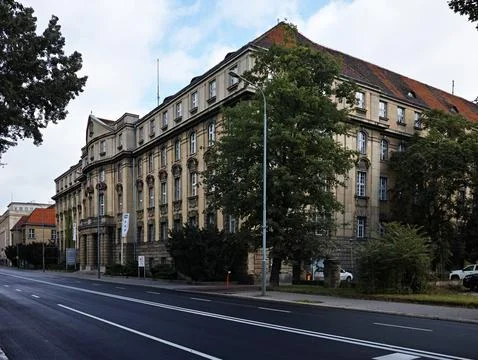 A large building with a tree in front of it Stock Photos