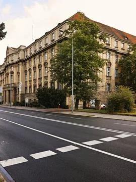 A large building with a tree in front of it Stock Photos