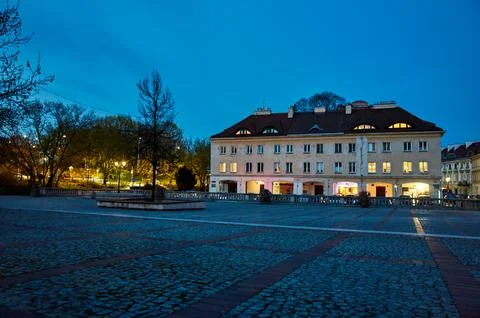 Large building with a tree in front of it Stock Photos