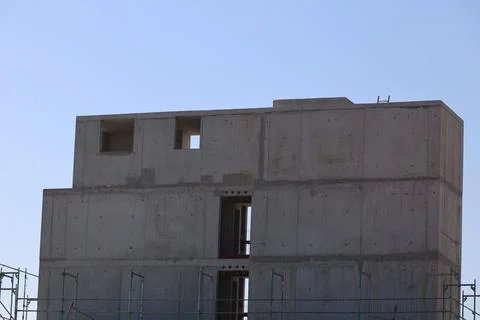 A large building with a window on the side Stock Photos