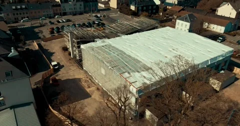 Large Building Wrapped in White Sheeting, Facade Renovation, Aerial Drone Shot Stock Footage 340314933
