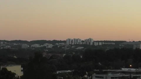 Large buildings at dusk. Stock Photos