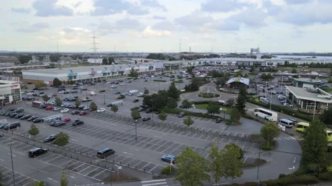 Large buildings with shops inside and vast carpark Stock-Footage 164734349