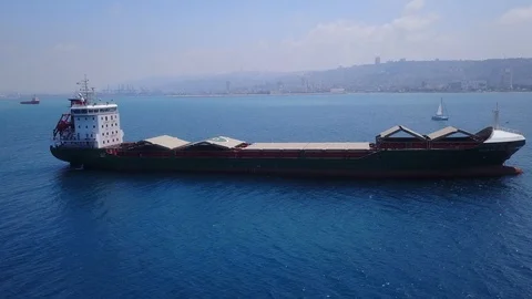 Large bulk carrier ship sailing in open oceanl  - aerial 4k view Stock Footage 110400907