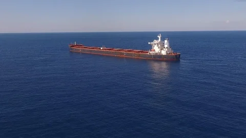 Large bulk carrier ship sailing in open oceanl  - aerial 4k view Stock Footage 110813270