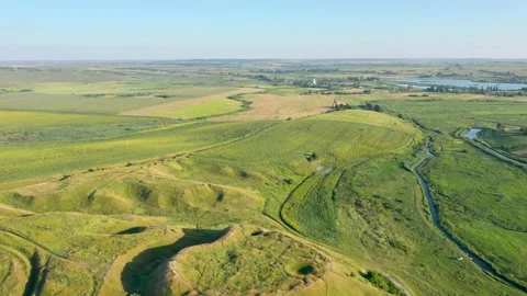 A large bulk mountain among the green field Stock Footage 161827362