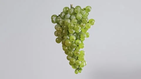 Large bunch of white grapes on a white background rotates 360 degrees Stock Footage 268744353