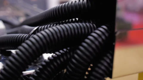 A large bundle of black corrugated tubes to protect electrical and other cables  Stock Footage 98210104