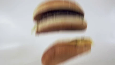 Large burger falling in slow motion Stock Footage 72623077
