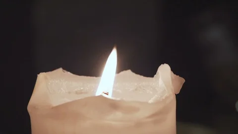 A large burning candle is wrapped in white dense smoke. Stock Footage 104516987