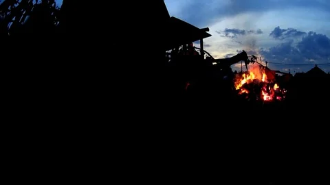 Large burning fire near cottage house in the night Video stock 75034479