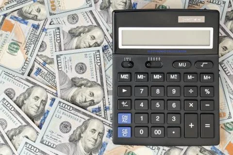 Large calculator on dollar Stock Photos