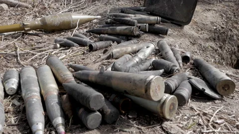 Large caliber cartridges rounds on the ground Stock-Footage 197280077