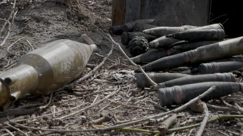 Large caliber cartridges rounds on the ground Видео 197280089