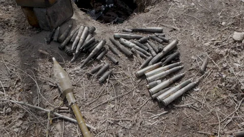 Large caliber cartridges rounds on the ground Stock-Footage 197329328