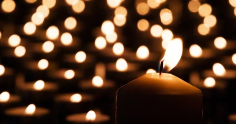 Large Candle on the Background of Small 4K Видео 103511313