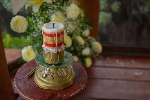 Large candle for the rite of baptism. Stock Photos