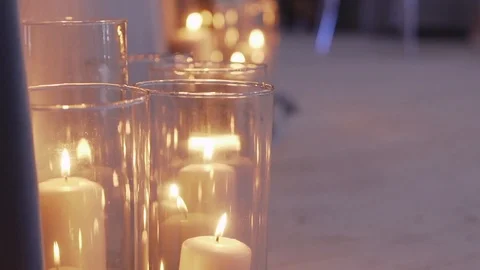 Large candles burn in glass flasks Stock-Footage 106945026