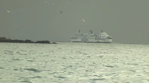 Large Car Ferry Navigating Rocky Coast in Winter 스톡 동영상 1805775