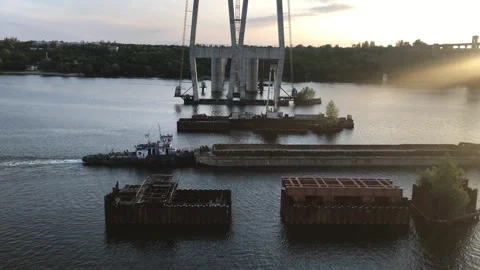 A large cargo barge without cargo passes along a wide river near the Stock Footage 159119541