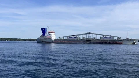 A large cargo carrier on a river Stock Footage 162355223