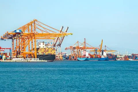 Large cargo container ship loaded with containers in the seaport Stock Photos
