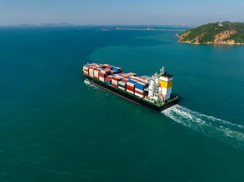 Large Cargo Container Ship Sailing Across Blue Tropical Waters Near Si Rach.. Stock Photos