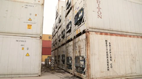 Large cargo containers stacked in a busy shipping yard during the day Stock Footage 318183959